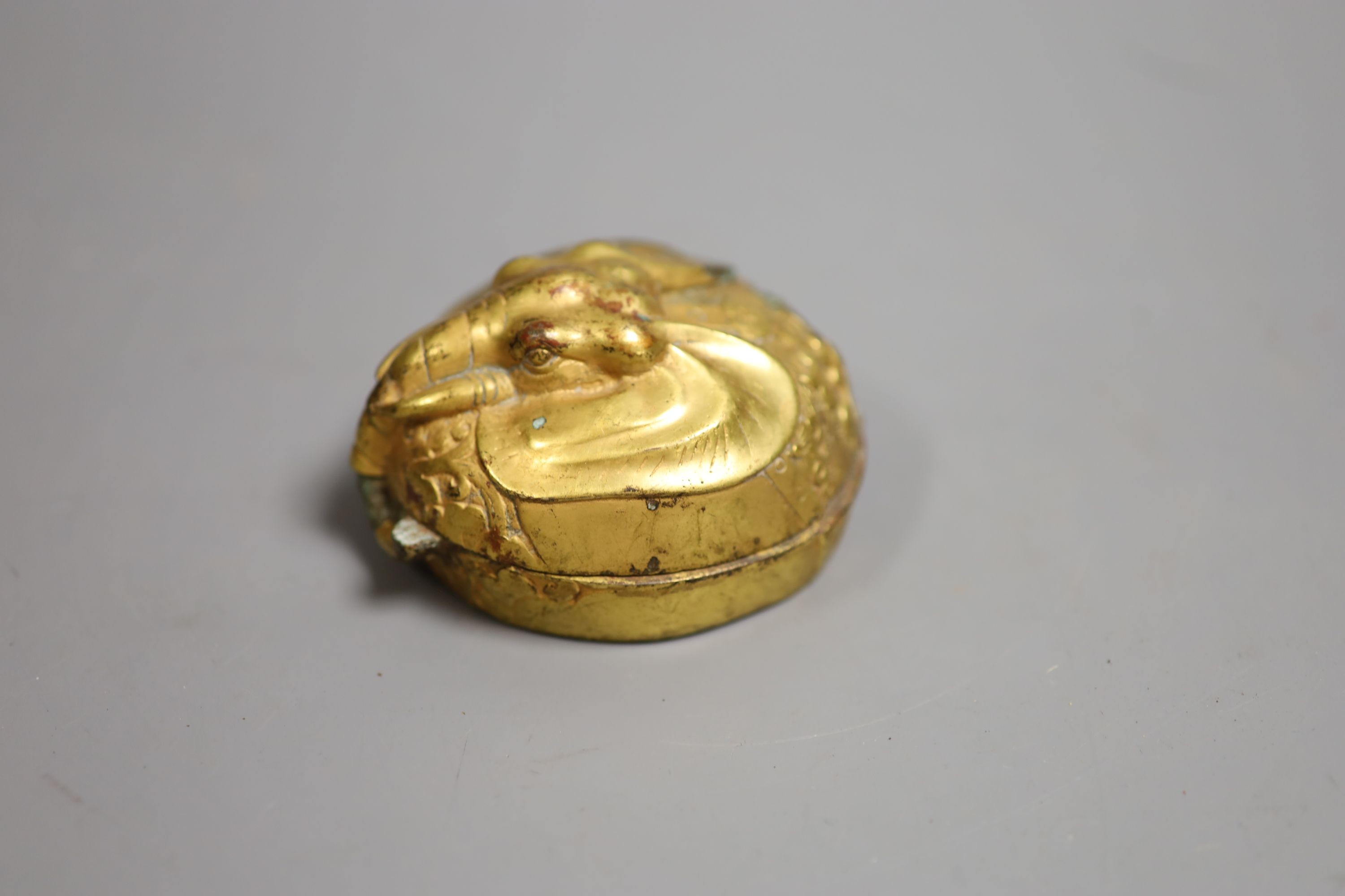 A Chinese gilt bronze elephant charm box, base 7cm diameter